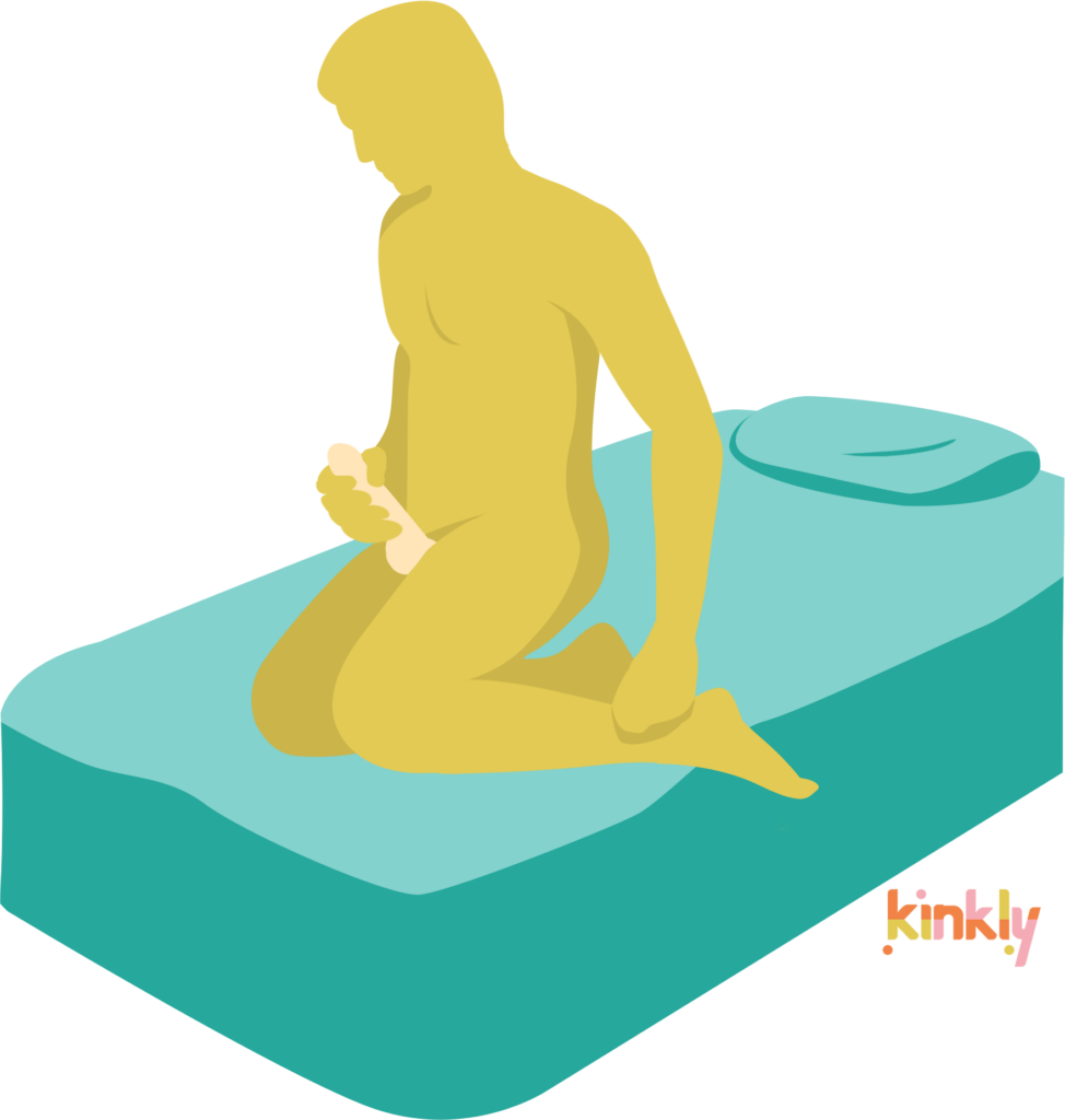 Kneeling Kneading sex position. A person is kneeling on a bed, stroking their penis. | Kinkly